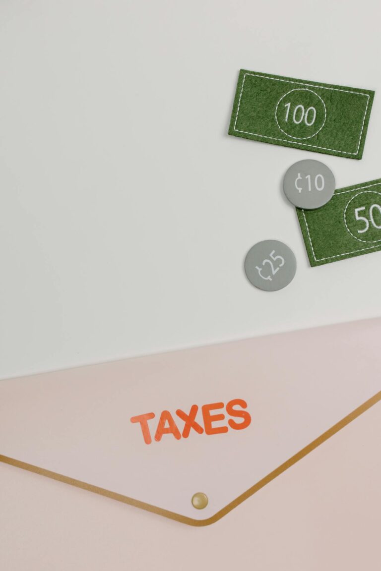 Minimalist image showcasing a tax-themed envelope and currency icons, perfect for finance concepts.